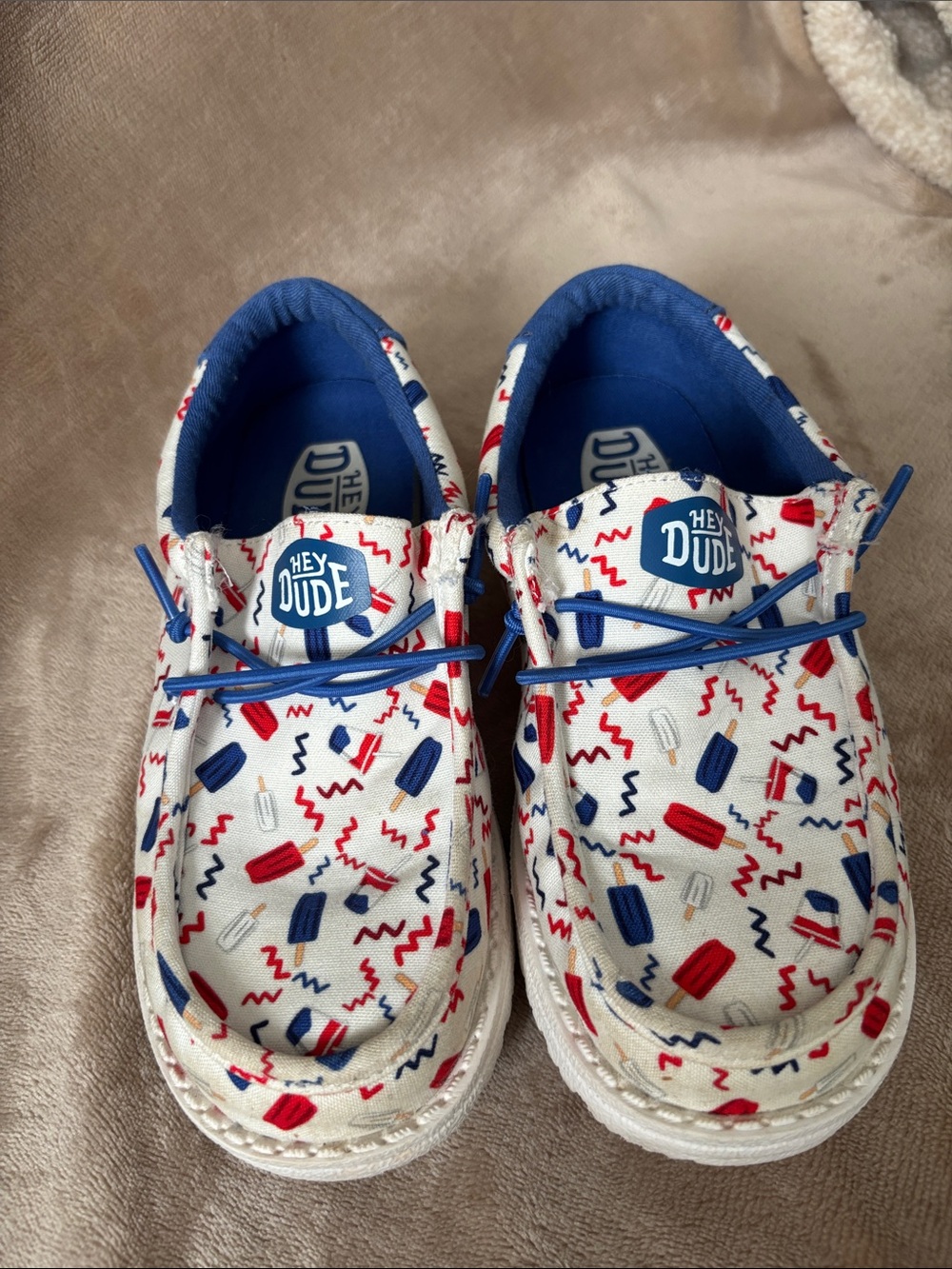 Hey Dude Kids White Slip-On Sneakers with Red & Blue Pattern